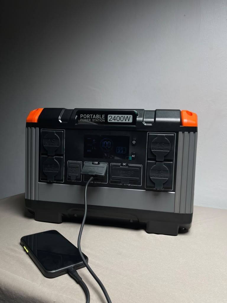 OA PowerCore 2400 charging a phone over USB in everyday use